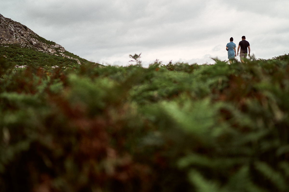 couple walking up a hill
