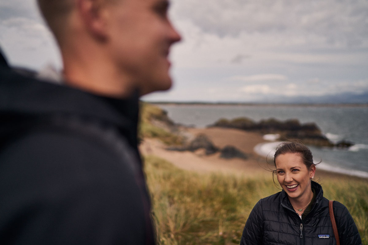 girlfriend smiling at boyfriend on Llanddwyn Island