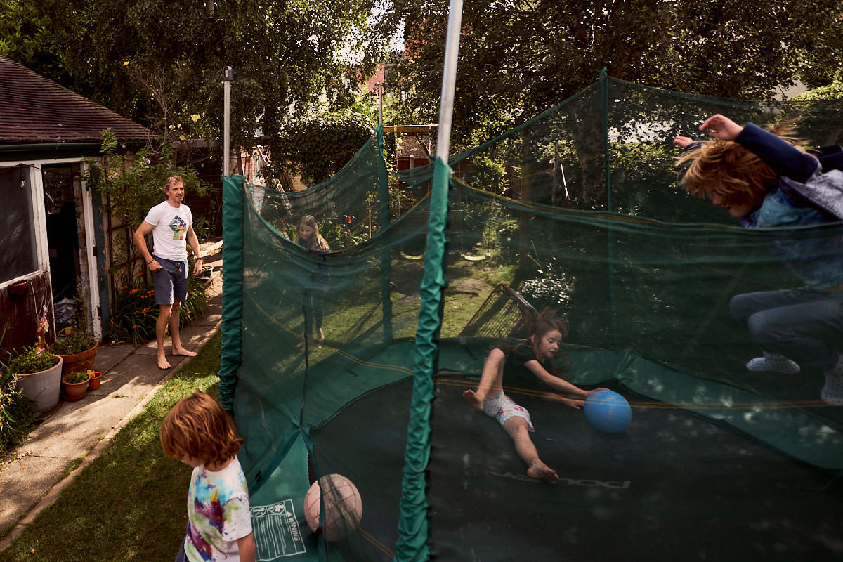family playing in the back garden during lockdown
