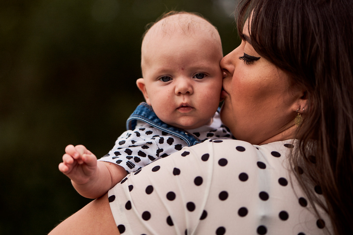 mum kissing her baby
