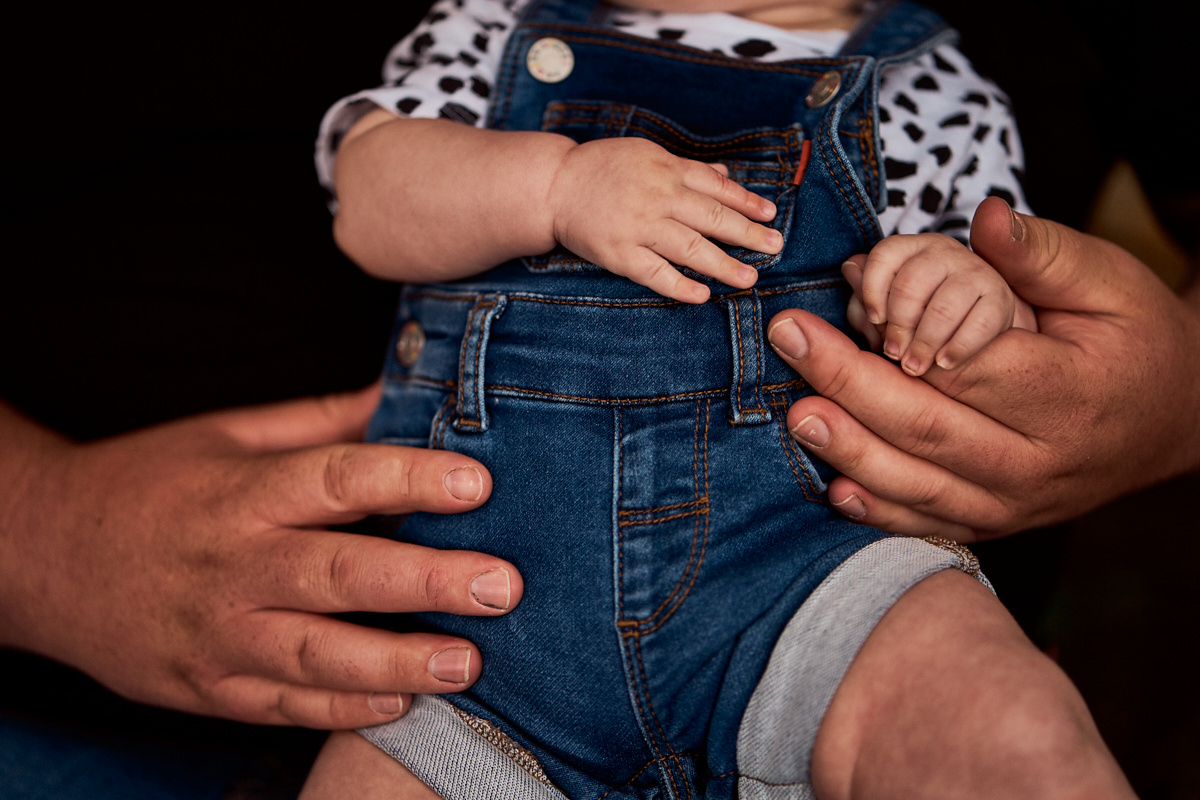 3 month old holding his dads finger