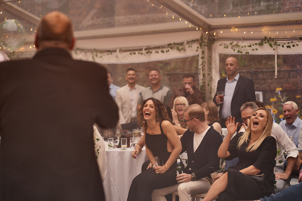 comedian making a crowd laugh