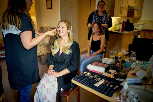 bride having hair and make-up done