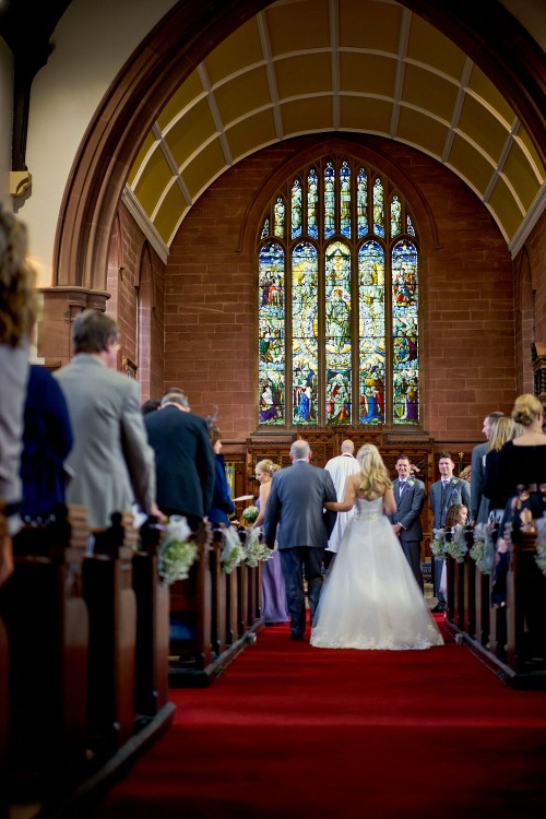 father of the bride giving his daughter away
