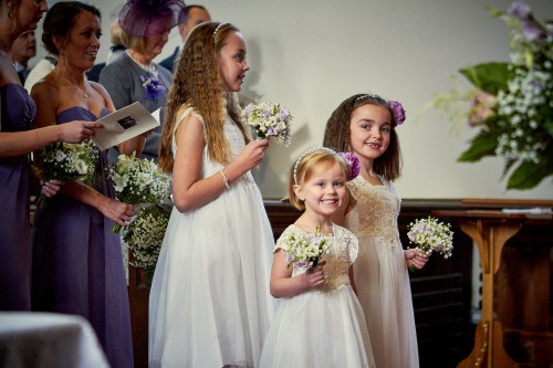 flower girls smiling in church