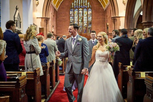 bride and groom walking down the isle
