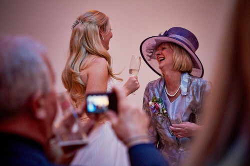 Bride laughing with mother of the bride
