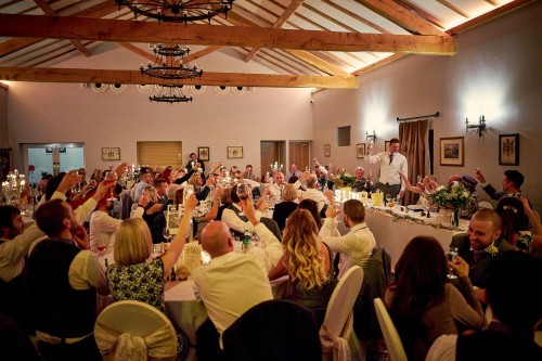 Groom toasting his wife