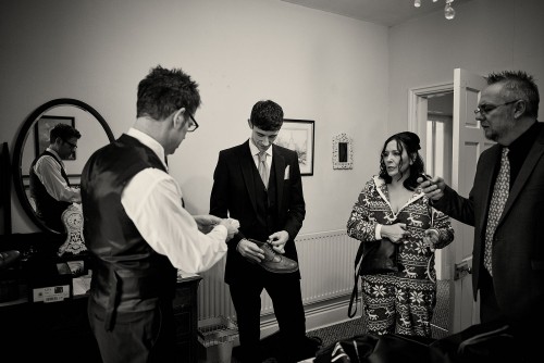 groom getting ready in Trevor Hall