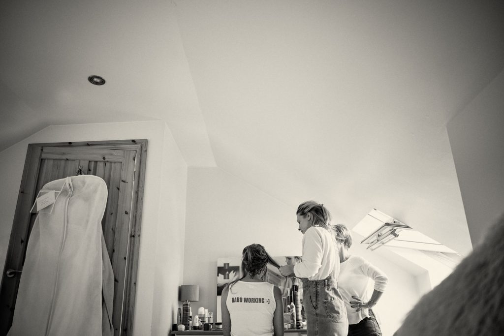 bride getting her hair styled