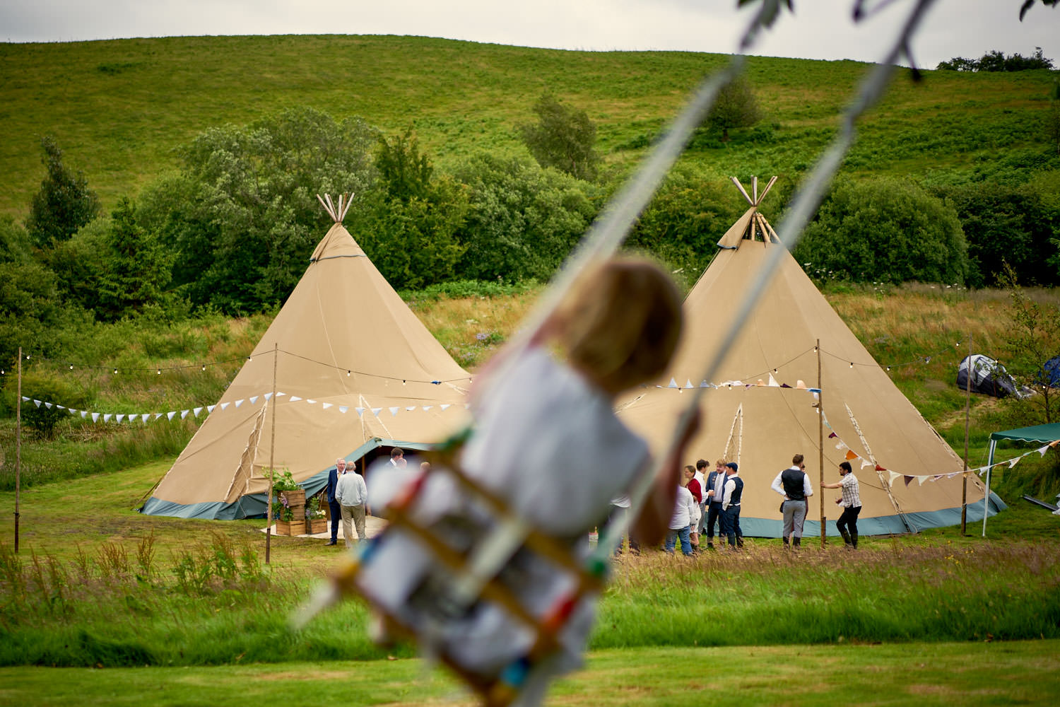 Tipi Wedding Reception Flower girl on swing