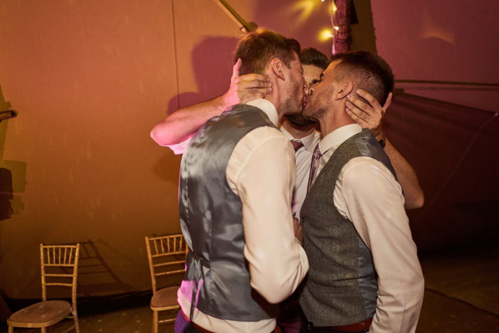 wedding guest kissing
