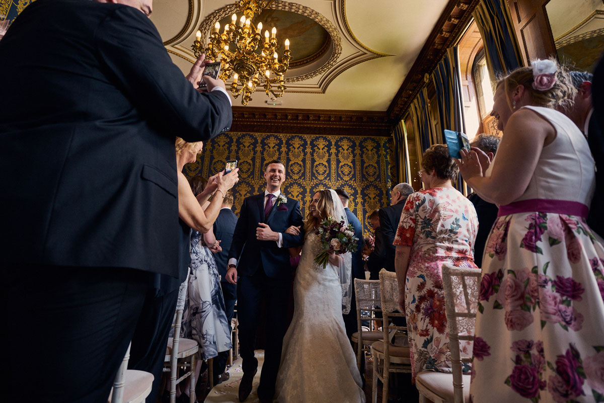 Bride & Groom leave Soughton Hall ceremony room arm in arm just married!