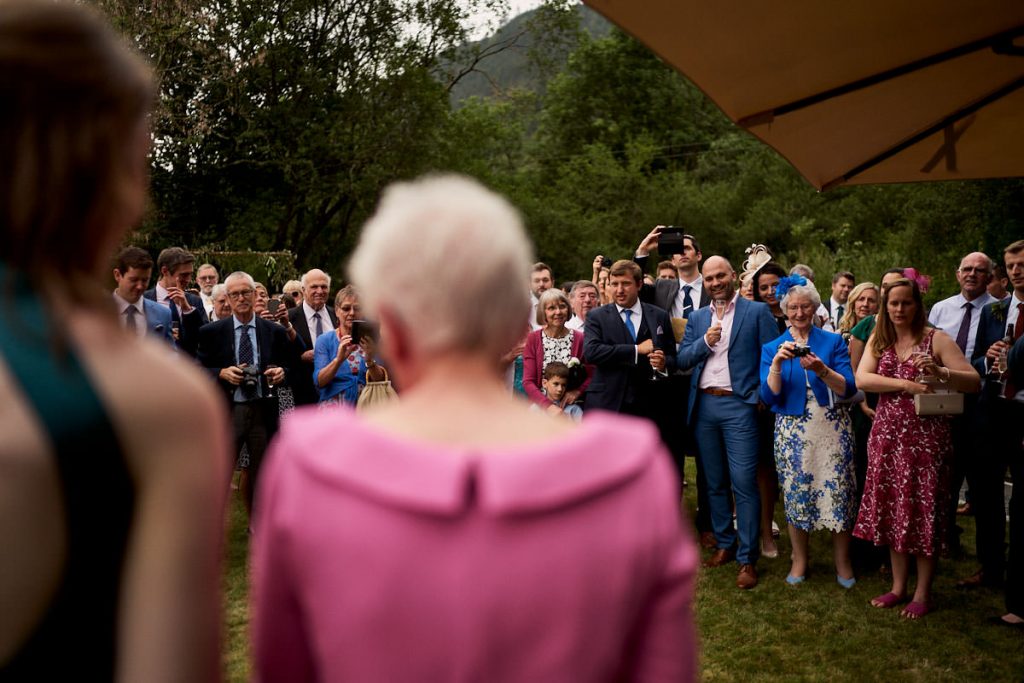 wedding guests laughing at speeches