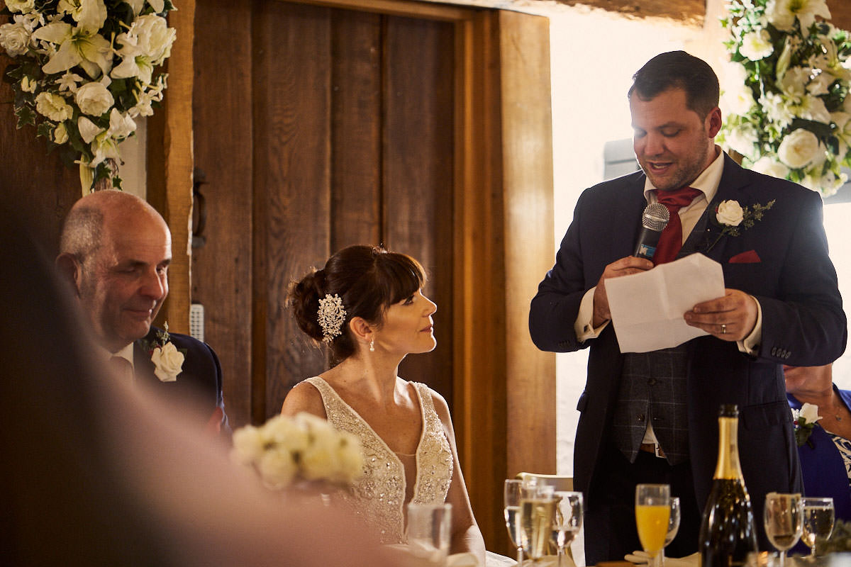 groom looking at bride while making his wedding speech